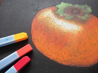 柿をオイルパステルで用い、手指で伸ばし描くチョークアートです。